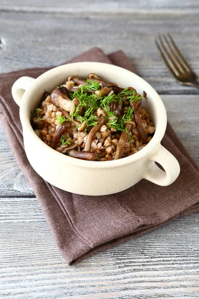 Tasty Buckwheat with mushrooms in a bowl — Stock Photo, Image