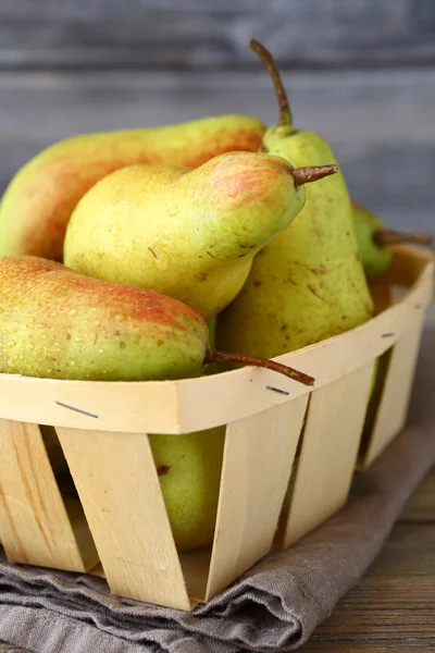 Juicy pears in wooden box — Stock Photo, Image