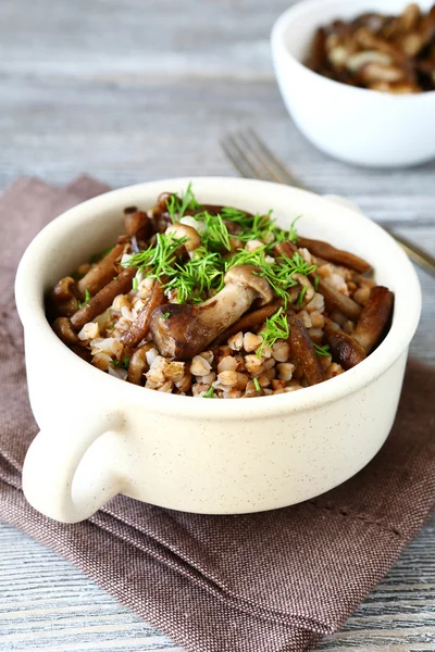 Russian buckwheat with mushrooms in a bowl — Stock Photo, Image