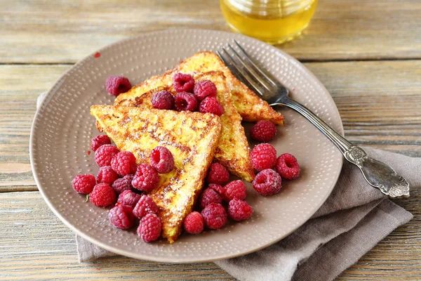 Tasty French toast with fresh raspberries — Stock Photo, Image