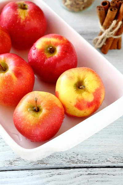 Red apples in a white bowl — Stock Photo, Image