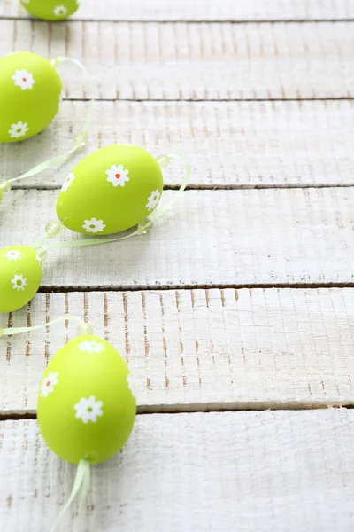 Easter garland on wooden boards — Stock Photo, Image