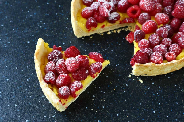 Delicious pie with raspberries on slate — Stock Photo, Image