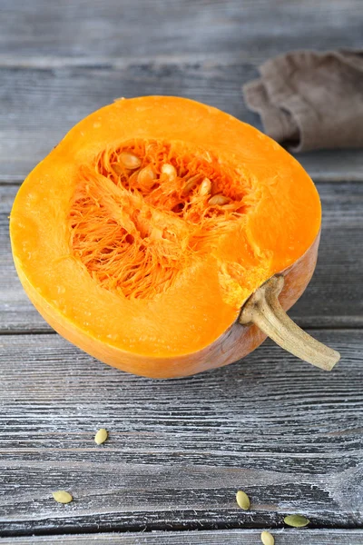 Half of raw pumpkin on the boards — Stock Photo, Image