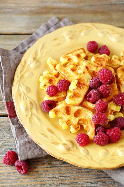 Waffles with raspberries on a white plate — Stock Photo, Image