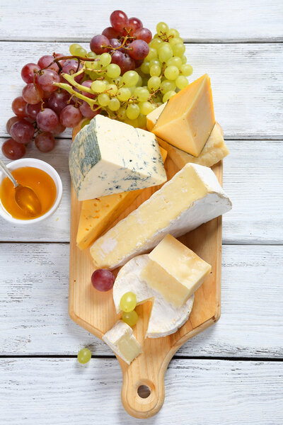 Cheeses with honey and grapes