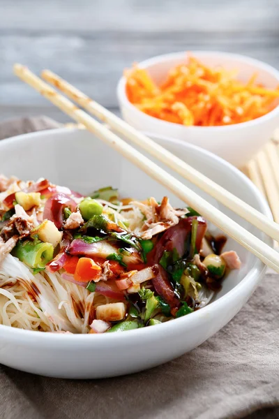 Noodles with tuna in a white bowl — Stock Photo, Image