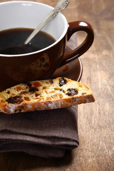 Sweet coffee with biscotti on the boards — Stock Photo, Image