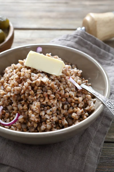 Tasty Buckwheat with butter in a bowl — Stock Photo, Image