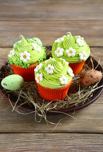 Easter cupcakes on hay — Stock Photo, Image