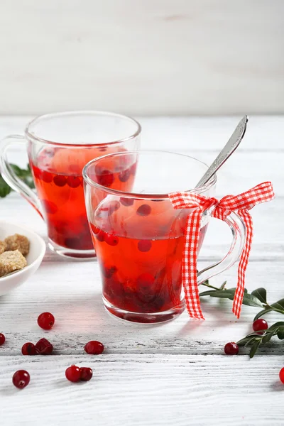 Christmas cranberry tea on the boards — Stock Photo, Image