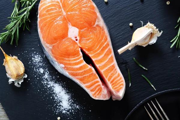 Raw Salmon on slate background — Stock Photo, Image