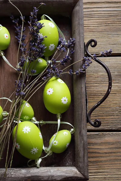 Green Garland in the form of eggs on a tray — Stock Photo, Image