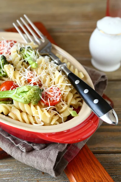 Pasta with broccoli pieces — Stock Photo, Image