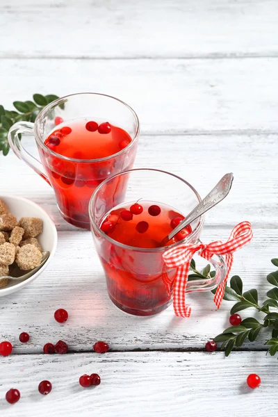 Cranberry tea on the boards — Stock Photo, Image