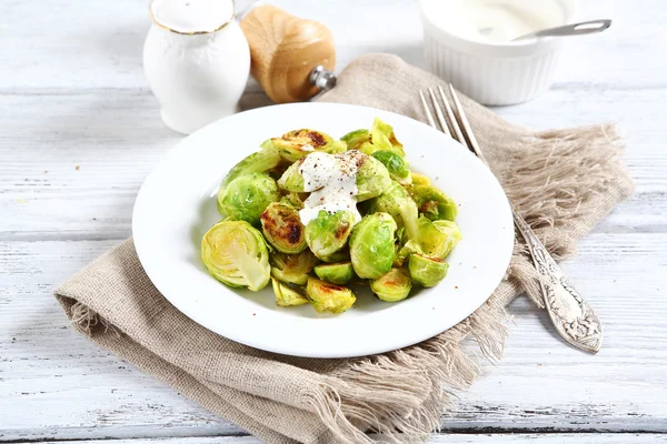 Brussels sprouts with sauce — Stock Photo, Image