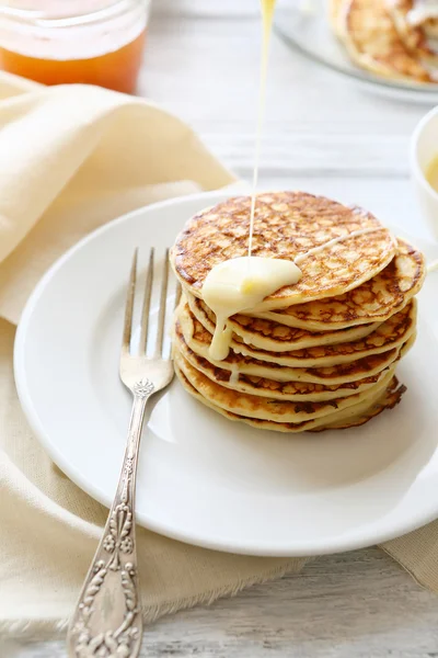 Pancakes with condensed milk — Stock Photo, Image