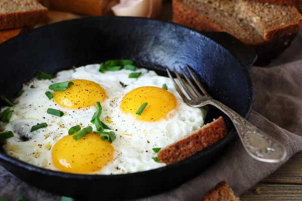 Hot fried eggs in a pan — Stock Photo, Image