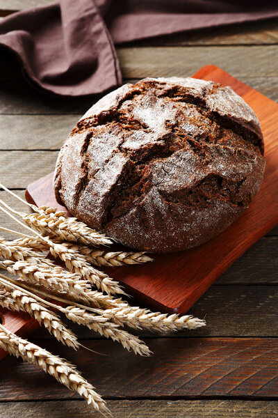 Delicious brown bread on the board