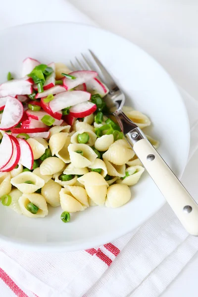 Pasta with radish and green pea — Stock Photo, Image