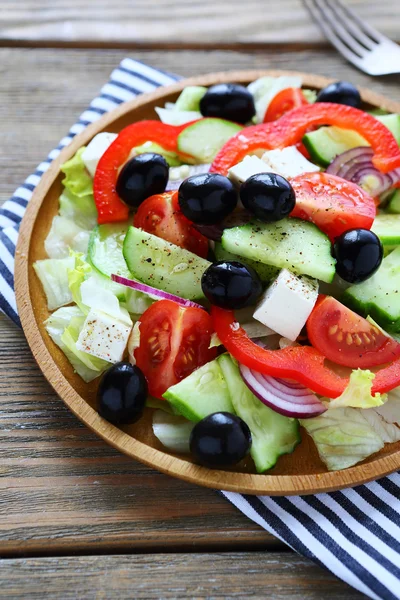 Fresh greek on wooden plate Royalty Free Stock Photos