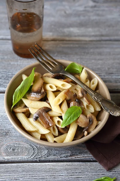 Pasta with champignons and greens — Stock Photo, Image