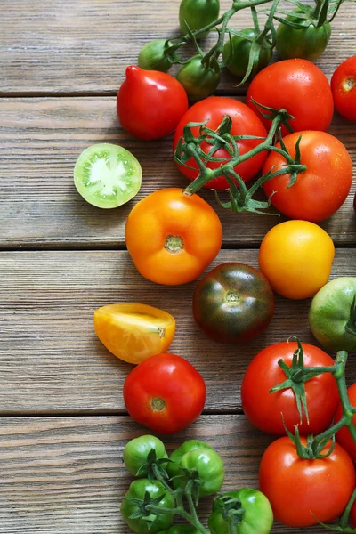 Fresh tomatoes on boards — Stock Photo, Image