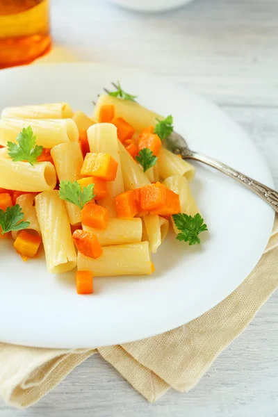 Pasta with carrot on a plate — Stock Photo, Image