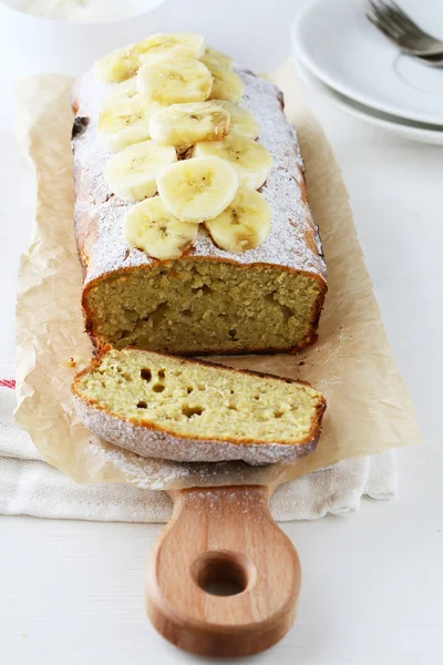 Sliced banana cake on board — Stock Photo, Image