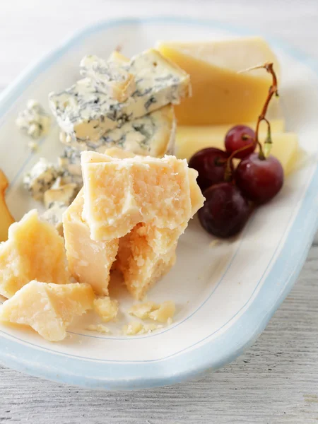 Cheeses on plate — Stock Photo, Image