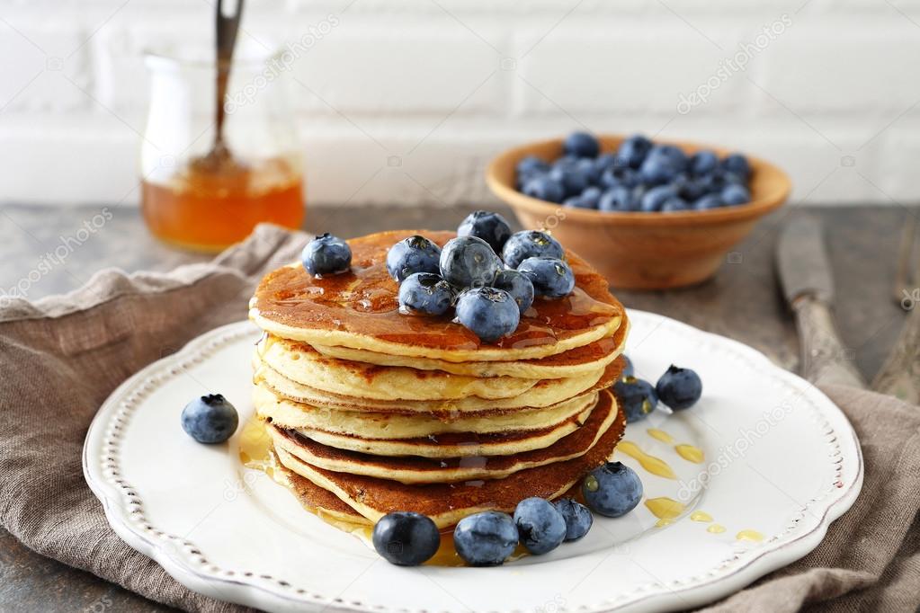 hot pancakes in stack with berries
