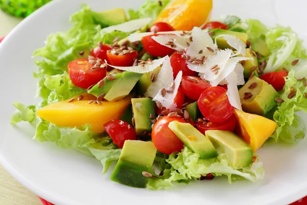 Salad with avocado on white plate — Stock Photo, Image