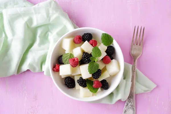 Salad with melon and summer berries — Stock Photo, Image