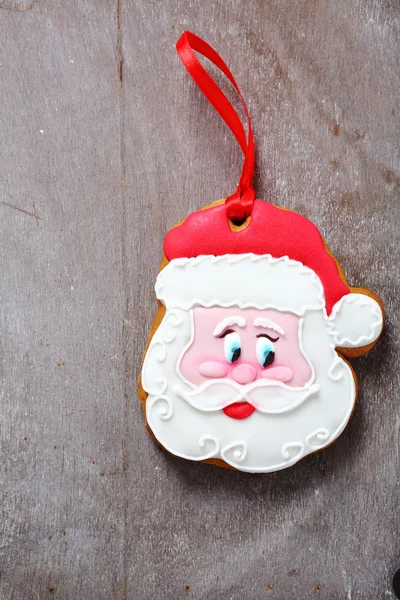Soubory cookie Santa Claus na dřevěné pozadí — Stock fotografie