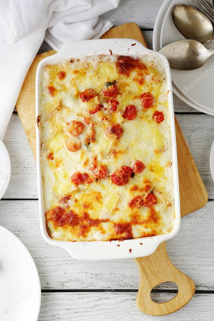 lasagna with cheese in baking dish