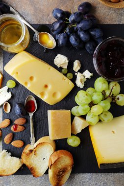 cheese with fruits and toasts