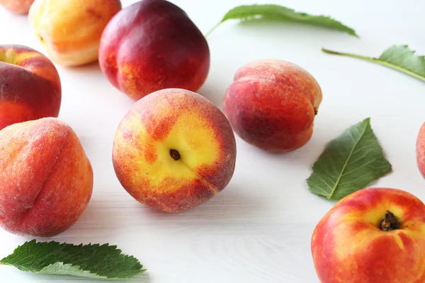 Sweet peaches on white background — Stock Photo, Image
