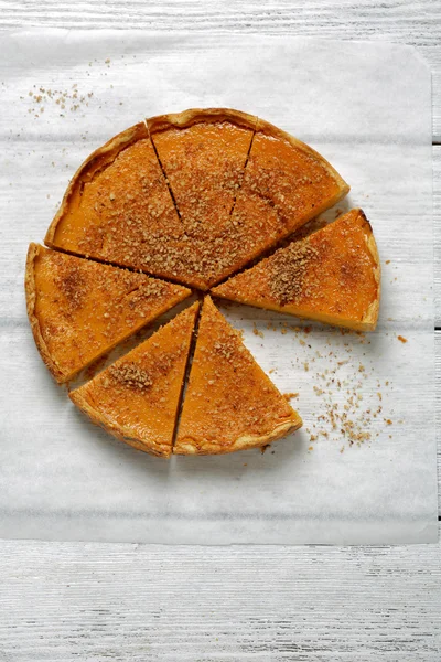 Autumn pumpkin pie on white boards — Stock Photo, Image