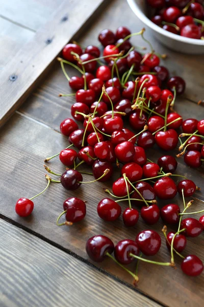 Ripe fresh cherry on old boards — Stock Photo, Image