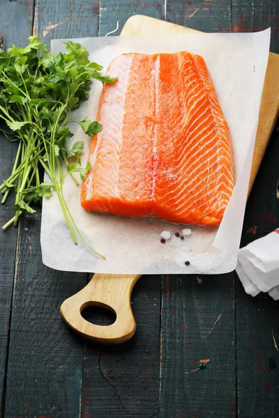 Fresh salmon steak on white paper — Stock Photo, Image