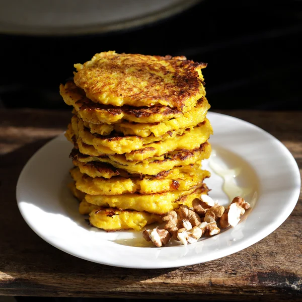 Stack of pumpkin fritters on direct sunlight — Stock Photo, Image