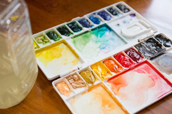 Paintbrush and paint palette — Stock Photo, Image