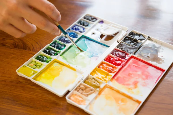 Paintbrush and paint palette — Stock Photo, Image