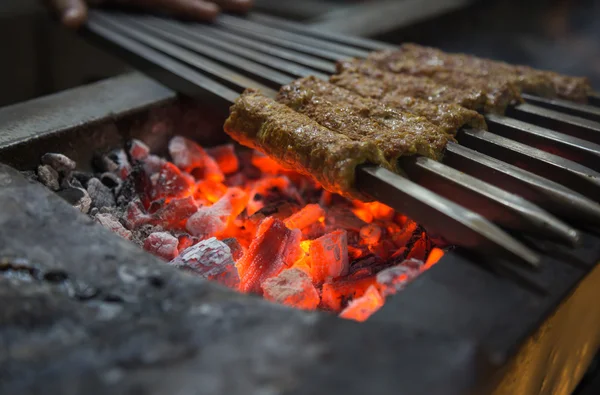 Tikka, shish, kofta kebabs on charcoal barbeque — Stock Photo, Image