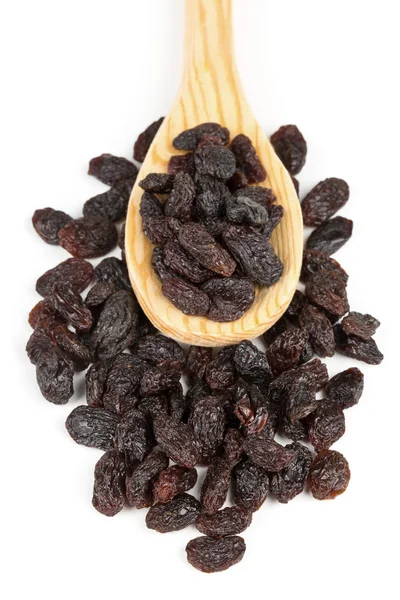 Raisins in wooden spoon — Stock Photo, Image