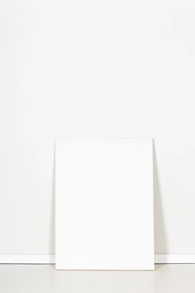 Empty canvas in white room — Stock Photo, Image