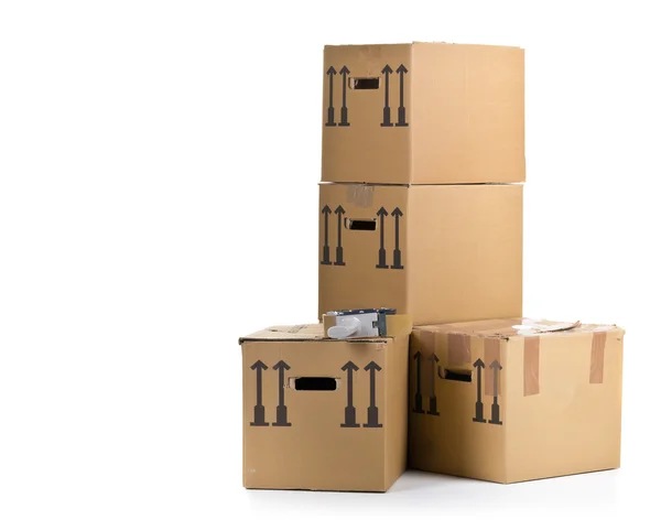 Moving carton boxes stack with tape roller — Stock Photo, Image