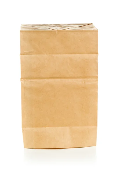 Recycled brown paper bag upside down over white background — Stock Photo, Image