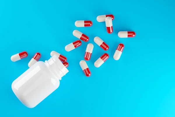 青の背景に白い錠剤ボトル付きの赤と白の錠剤カプセル 医薬品や薬のコンセプト 上からのフラットレイトップビュー 3Dイラスト — ストック写真