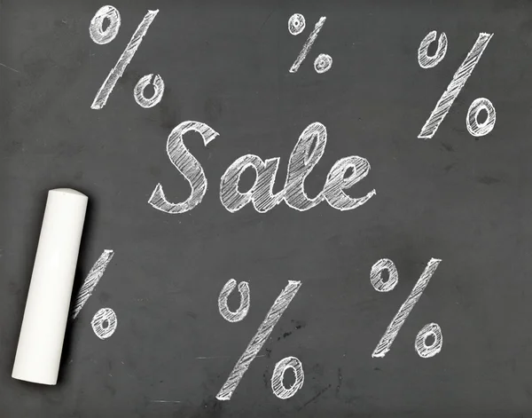 Sale chalk writing with percentage signs on chalkboard — Stock Photo, Image